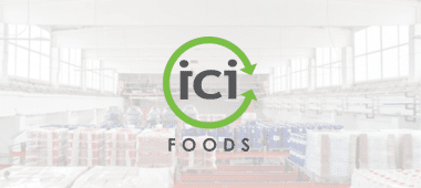 ICI Foods logo over a blurred warehouse scene, representing the company's role in food distribution and supply chain.